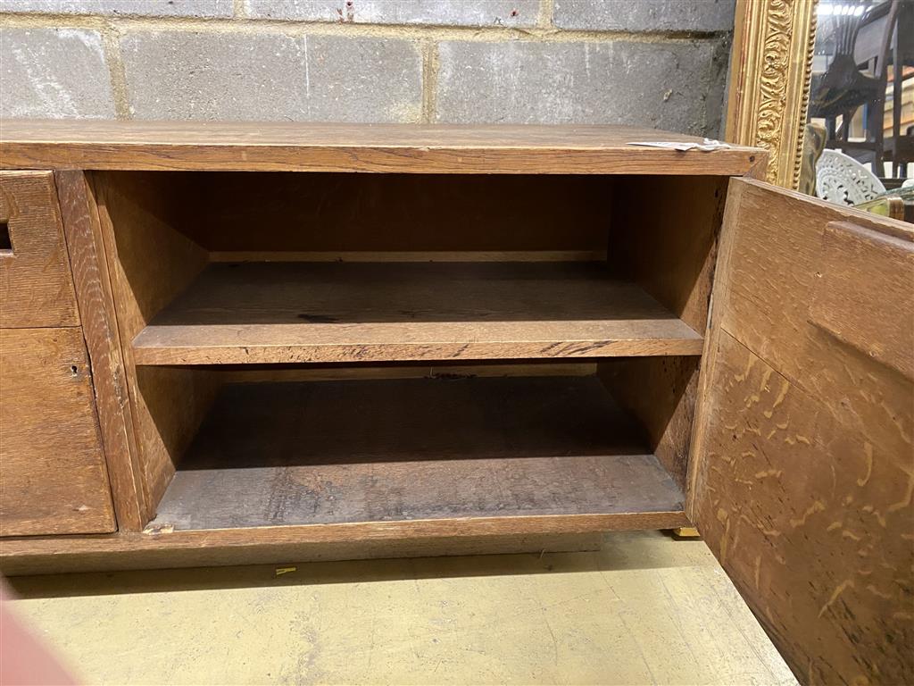 A Betty Joel style oak two door low cabinet, length 137cm, depth 44cm, height 55cm